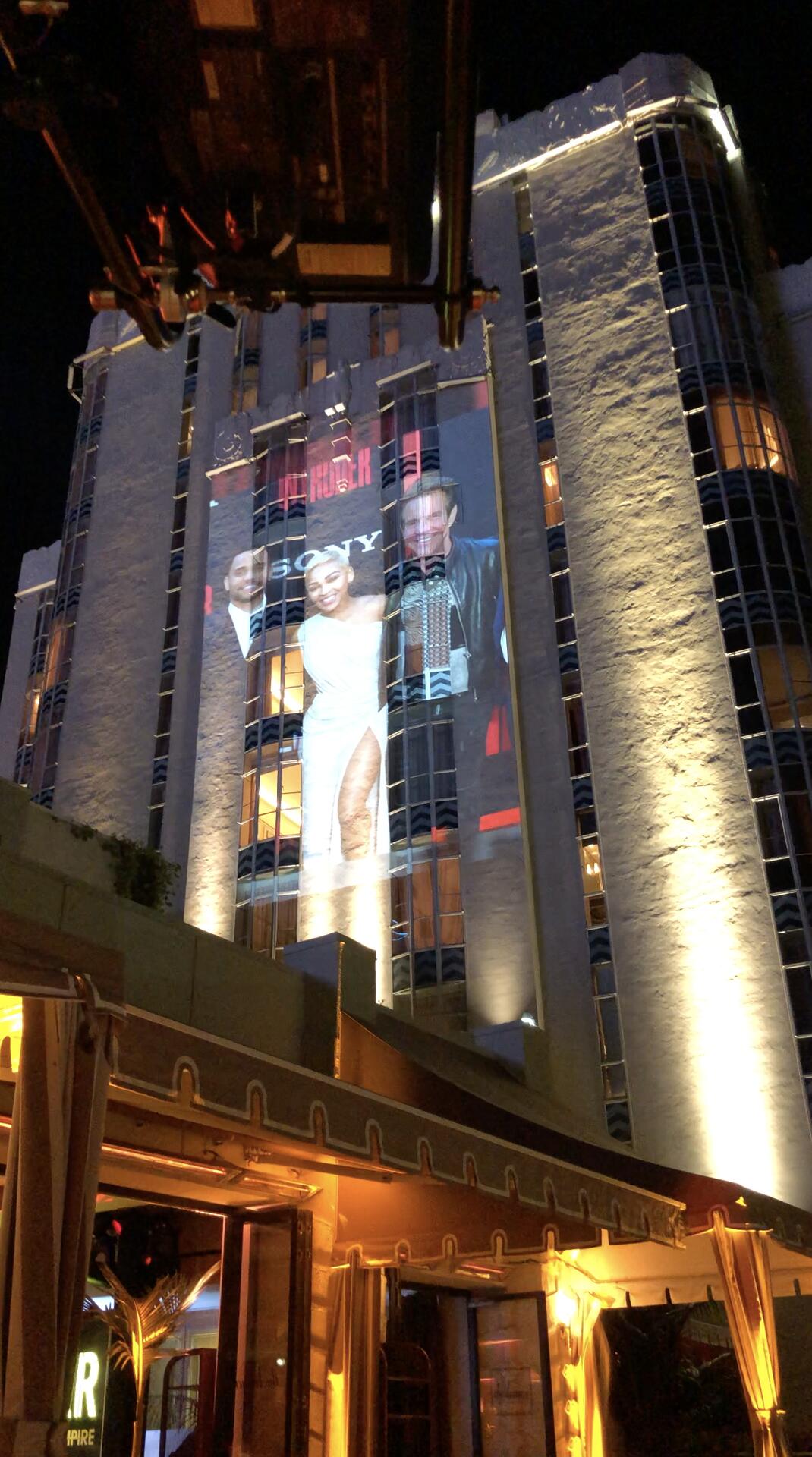 Projection mapping on exterior of tall building at night